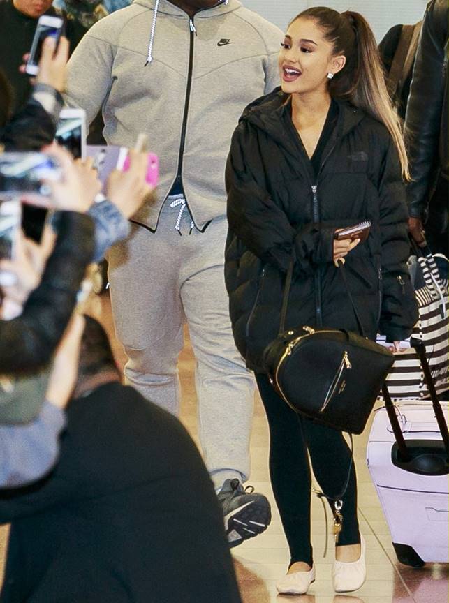 Ariana Grande arrives at Tokyo International Airport greeted by many waiting fans