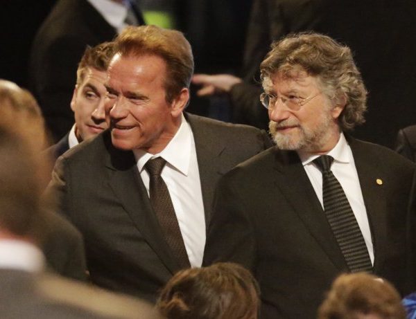 Former Governor of California Arnold Schwarzenegger, center, arrives for Muhammad Ali's memorial service, Friday, June 10, 2016, in Louisville, Ky. (AP Photo/David Goldman)