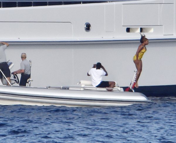 17 AUG 2016 - Sardinia - Italy ***PREMIUM EXCLUSIVE PICTURES-MUST CALL FOR PRICING BEFORE USAGE*** *AVAILABLE FOR UK SALE ONLY* Superstar Singer Beyonce pictured wearing a bright yellow swimsuit as she's seen gathering up some courage to take the Plunge from the highest floor of her Mega Yacht while husband Jay Z films the action and daughter Blue Ivy Looks on in Amazement at her Brave Mum....The happy family are enjoying their Holiday in trendy Porto Rotondo in Sardinia. BYLINE MUST READ : FREZZA-LAFATA-MCP/CIAOPIX ***UK CLIENTS - PICTURES CONTAINING CHILDREN PLEASE PIXELATE FACE PRIOR TO PUBLICATION *** **UK CLIENTS MUST CALL PRIOR TO TV OR ONLINE USAGE PLEASE TELEPHONE 44 208 344 2007**