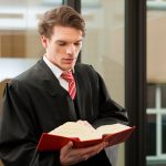 Lawyer with civil law code in a court room