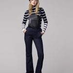 Gigi-wears-striped-shirt-under-her-overalls