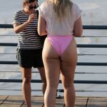 Iskra Lawrence Changes Into A Pink One Piece Bikini As She Nibbles On Cotton Candy With Other Models