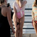 Iskra Lawrence Changes Into A Pink One Piece Bikini As She Nibbles On Cotton Candy With Other Models