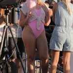 Iskra Lawrence Changes Into A Pink One Piece Bikini As She Nibbles On Cotton Candy With Other Models