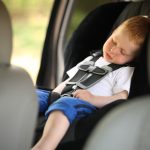Boy sleeping in child car seat