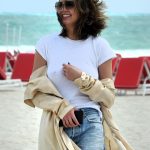 Chrissy Teigen Goes Braless in a White T-shirt as she Takes a Walk on the Beach in Miami