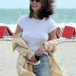 Chrissy Teigen Goes Braless in a White T-shirt as she Takes a Walk on the Beach in Miami