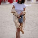 Chrissy Teigen Goes Braless in a White T-shirt as she Takes a Walk on the Beach in Miami
