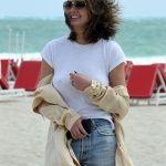 Chrissy Teigen Goes Braless in a White T-shirt as she Takes a Walk on the Beach in Miami