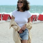 Chrissy Teigen Goes Braless in a White T-shirt as she Takes a Walk on the Beach in Miami