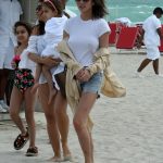 Chrissy Teigen Goes Braless in a White T-shirt as she Takes a Walk on the Beach in Miami