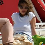 Chrissy Teigen Goes Braless in a White T-shirt as she Takes a Walk on the Beach in Miami