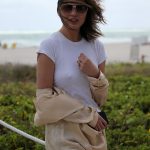 Chrissy Teigen Goes Braless in a White T-shirt as she Takes a Walk on the Beach in Miami