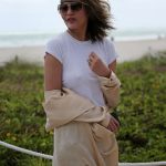 Chrissy Teigen Goes Braless in a White T-shirt as she Takes a Walk on the Beach in Miami