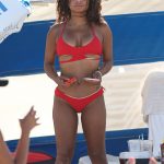 Christina Milian shows off her incredible figure in a small halter neck bikini while enjoying the sunshine with friends in Miami Beach