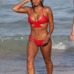 Christina Milian shows off her incredible figure in a small halter neck bikini while enjoying the sunshine with friends in Miami Beach