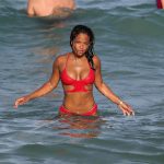 Christina Milian shows off her incredible figure in a small halter neck bikini while enjoying the sunshine with friends in Miami Beach