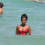 Singer Christina Milian hits the beach in a red bikini