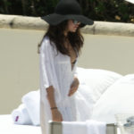 Selena Gomez walks through the pool at her hotel in Miami