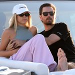 Scott Disick wraps his arms around girlfriend Sofia Richie as they watch the sunset from a yacht in Miami